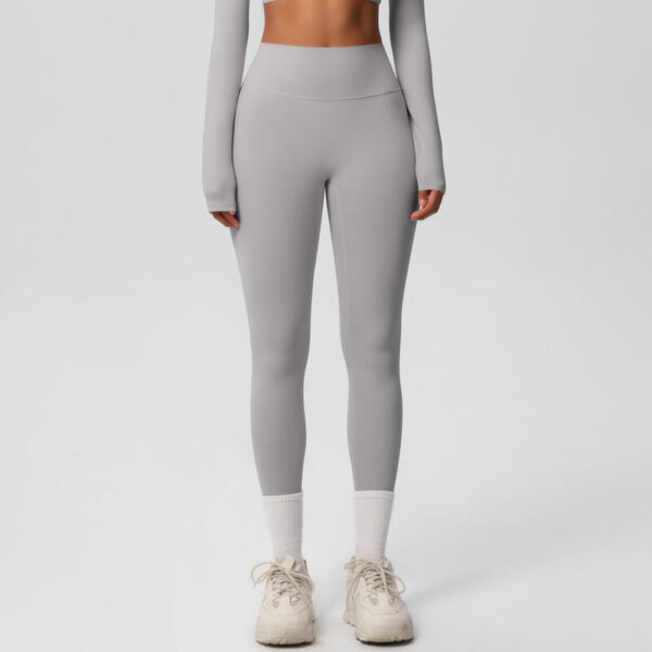 image of woman wearing leggings in grey