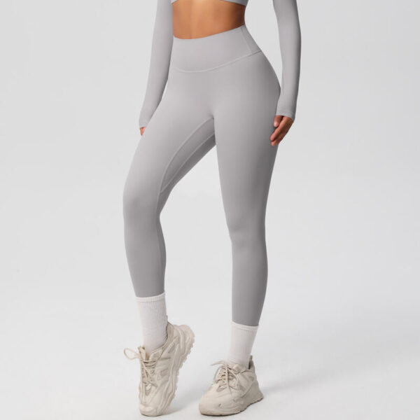 image of woman wearing grey leggings